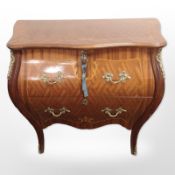 A continental King wood veneered and satin wood inlaid bombe chest,