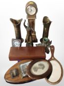 A miniature longcase clock, a pair of trench art vases, a further brass candlestick base,