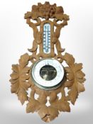 A Danish heavily carved beech barometer, length 53cm.
