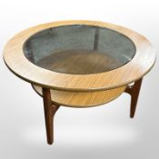 A G Plan teak circular coffee table with smoked glass top,