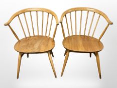 A pair of Ercol stained elm spindle back armchairs