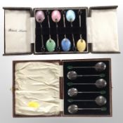 Two sets of six silver coffee spoons, one with enamelled decoration, boxed.