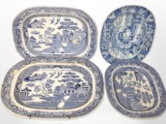 A group of four blue and white meat plates, largest 46cm wide.