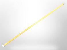 A carved staff with silvered pommel, length 197cm.