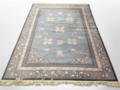 A machine made carpet on blue ground,