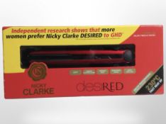 A pair of Nicky Clarke hair straighteners, in box.