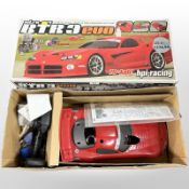 An HPI Racing RTR3 Evo 1/10th scale four-wheel drive nitro-powered RC car, in box.