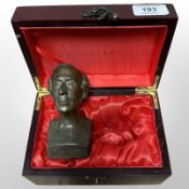 A small patinated metal bust of Hans Christian Andersen in fitted box, height 12cm.