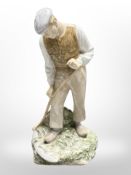 A Bing & Grøndahl figure of a harvester wielding a scythe, height 26cm.