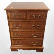 A reproduction mahogany cabinet with dummy drawers,