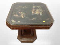 A Japanese carved hardwood and hard stone inset coffee table, with plate glass top,
