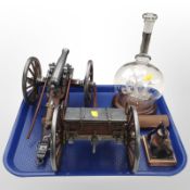 A glass model of the Mayflower in decanter on turned wooden plinth,