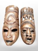A large pair of wooden tribal wall masks,