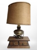 A contemporary table lamp on stand, fitted two drawers,
