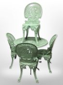 A painted cast-aluminium circular garden table and matching set of four chairs, table diameter 80cm.