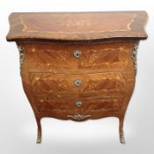 A continental Kingwood veneered and satin wood inlaid serpentine front chest,