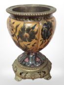 A Victorian brass and ceramic plant stand, height 24cm.