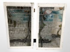 Four Art Nouveau stained glass windows in distressed painted frames,