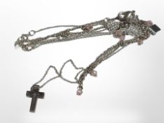 A silver crystal-inlaid crucifix pendant, and a further silver bracelet with encrusted decoration.