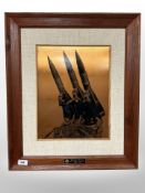 A copper-effect plaque depicting a military installation, 54cm x 64cm overall.