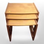 A 20th century teak nest of three tables, width 54cm.