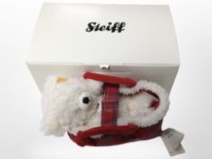 A Steiff Lizzy teddy bear in carry basket, with tags and original box.