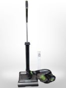 A Gtech upright vacuum cleaner and a hand-held vacuum.