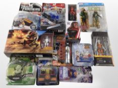11 various Hasbro and other figurines including Transformers, Star Wars, WWE, etc., boxed.