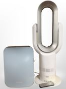 A Vortex hot and cold desk fan, height 66cm, together with a dehumidifier.