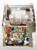 A child's model castle, and a quantity of plastic toy soldiers, figures on horseback, etc.