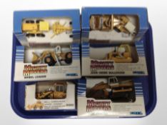 Five Ertl Mighty Movers die-cast models, and a further Joal model all boxed.