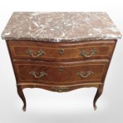 A continental kingwood-veneered serpentine-front two-drawer chest,