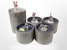 Five boxed Swarovski crystal figures including rabbit, cats, etc.