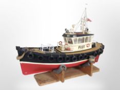 A remote control scale model of a trawler, on stand, lenght 77cm.