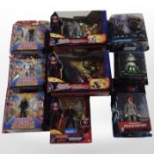 Nine Mattel and Funko figurines including Superman, Megaman, Halo, etc.