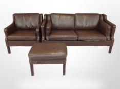 A late 20th century Danish brown leather two seater settee,