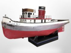 A large scale model remote control boat, on stand, length 141cm.
