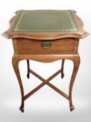 A reproduction mahogany single-drawer side table with green tooled leather-inset top,