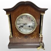 An Edwardian mahogany and satinwood-inlaid eight day mantel clock, height 27cm.