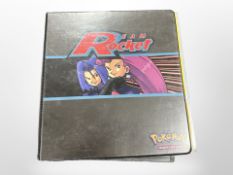 A binder containing a very large quantity of Pokémon cards, to include some shineys, trainer cards,