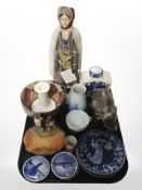 A group of Royal Copenhagen blue and white dishes, pottery ash tray surmounted by two penguins,