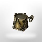 A 9ct gold drum charm, height 9mm. CONDITION REPORT: 1.