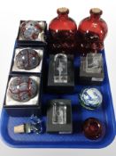 A group of modern glass paperweights, pair of decanters in the form of skulls, etc.