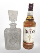 A bottle of Bell's Blended Scotch Whisky, 40% vol., 1 litre, together with a crystal decanter.
