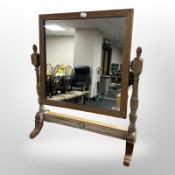 A Waring & Gillows carved oak dressing table mirror, height 57cm.