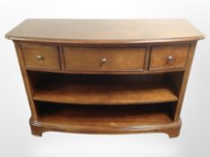 A Willis and Gambier three drawer sideboard fitted shelves beneath,