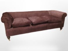 A Victorian style Chesterfield three seater settee, in plum fabric,
