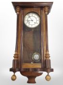 A Danish burr walnut eight day wall clock with enamelled dial, signed 'L Kirkeby, Kjobenhavn'.