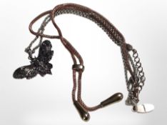 A silver chain with death's-head hawk moth pendant,