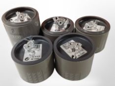 Five boxed Swarovski crystal figures including four fish and a frog.